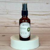 yuletide room and linen spray Bottle of Brigid Yuletide Room & Linen Spray on a wooden background